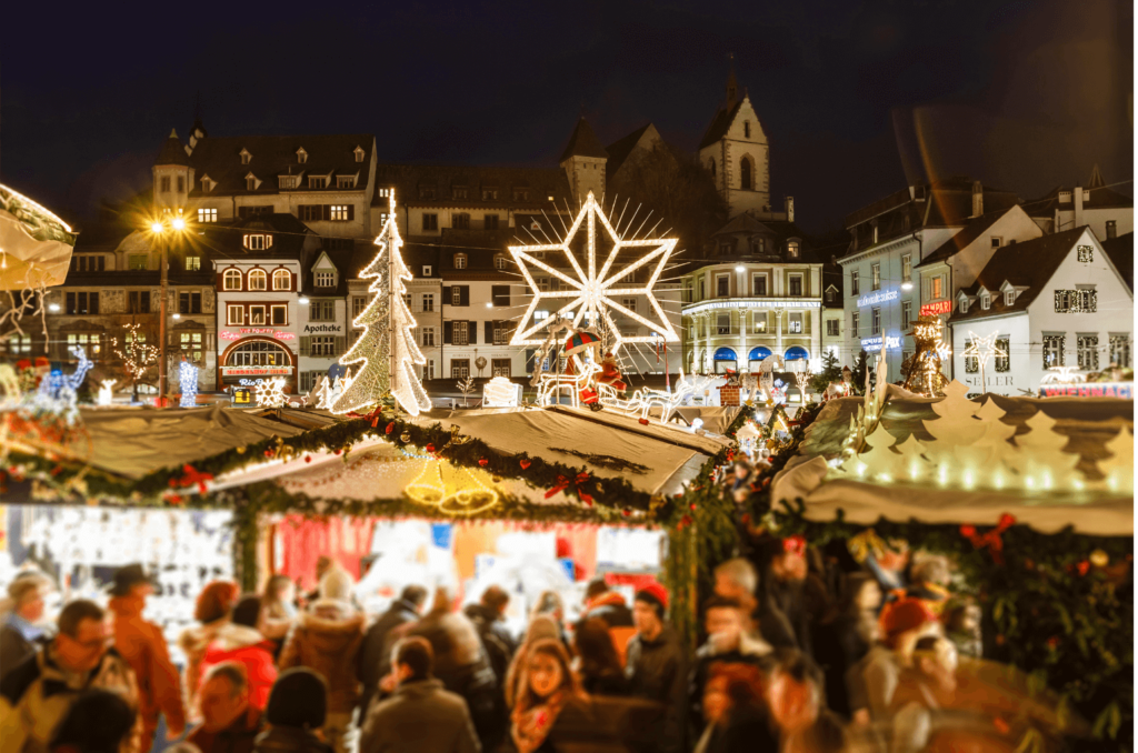 A crowd visiting kiosks at one of Basel's Christmas Markets in Switzerland.  
