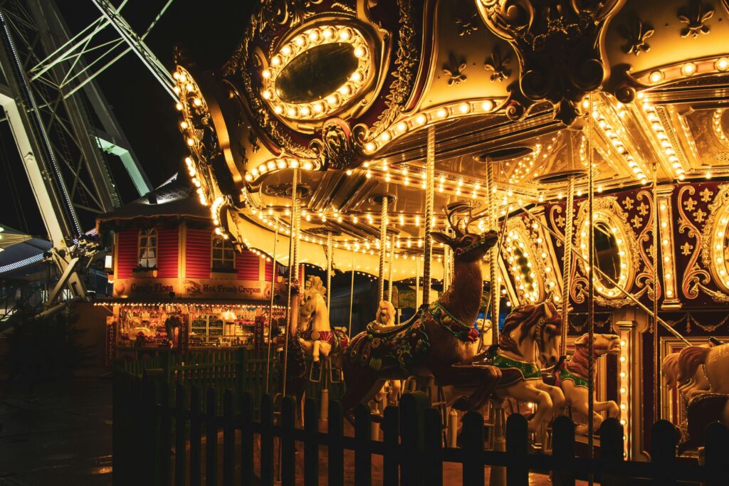 A lit up carousel at Winter Wonderland, one of the most famous Christmas Markets in London for families