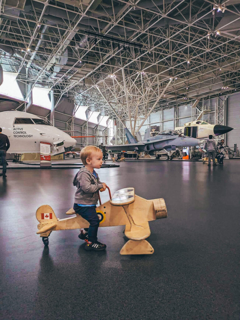 A toddler at the Canada Aviation and Space Museum - things to do in Ottawa with kids