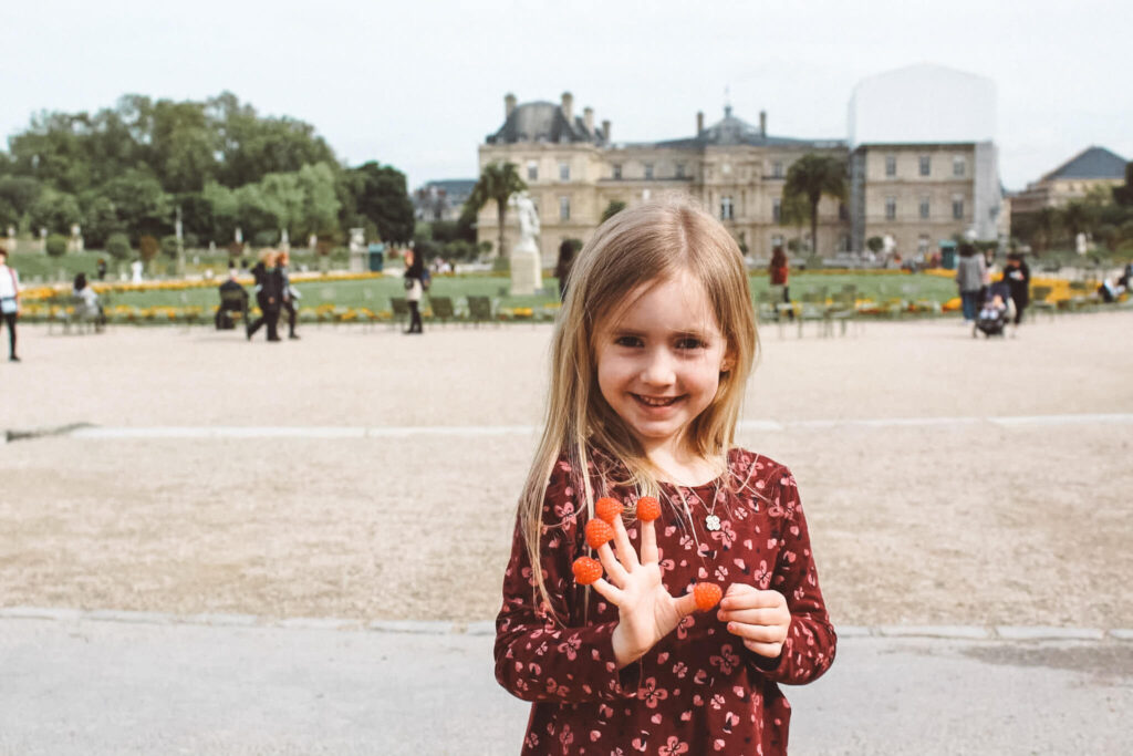 It's at the Jardin du Luxembourg that you will find one of the best playgrounds in Paris for families. Pictured: a little one having fun exploring the Luxembourg Garden.