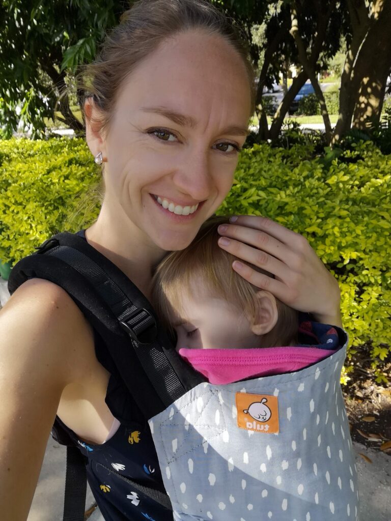 The Tula Standard Baby Carrier is the best travel baby carrier - I used it for both of my babies for all of our travels.
