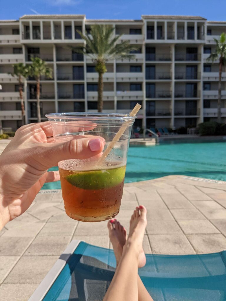 Holiday Inn Orlando Disney Springs has a beautiful pool and courtyard with family-firendly games. It's the perfect spot to relax and enjoy a drink.