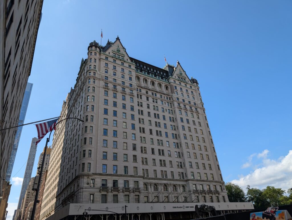 The Plaza Hotel facade in New York City on a clear day.