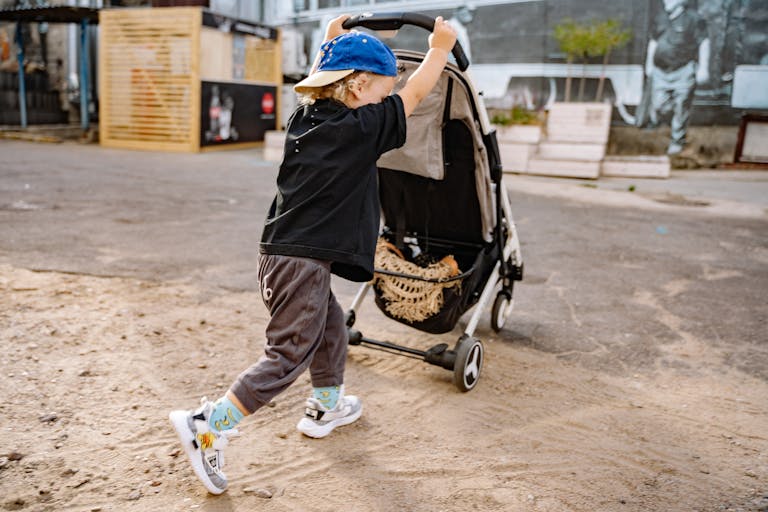 Boy Pulling Stroller