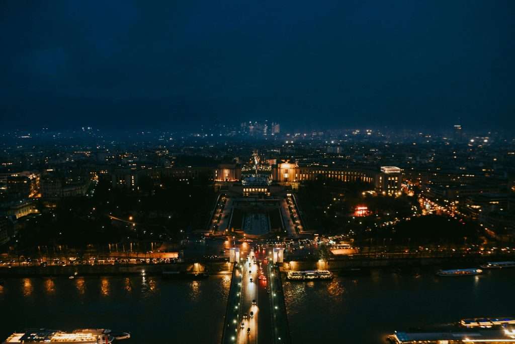 View of the lit-up Trocadéro in Paris at night.