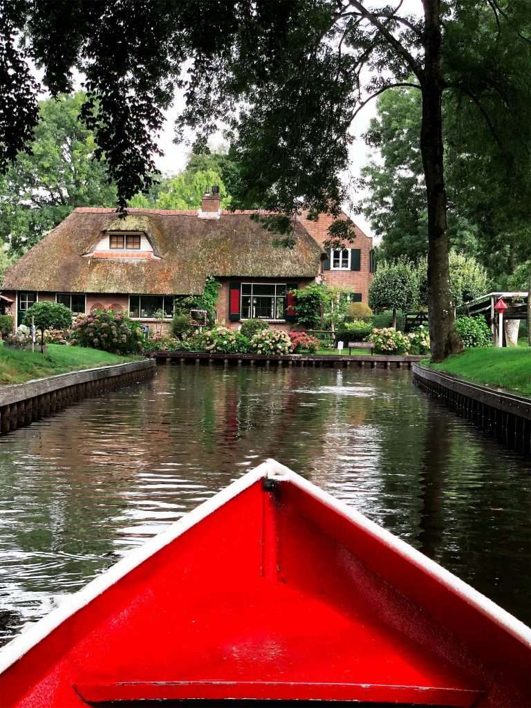 Giethoorn is a charming car-free city near Amsterdam - totally worth visiting with kids.