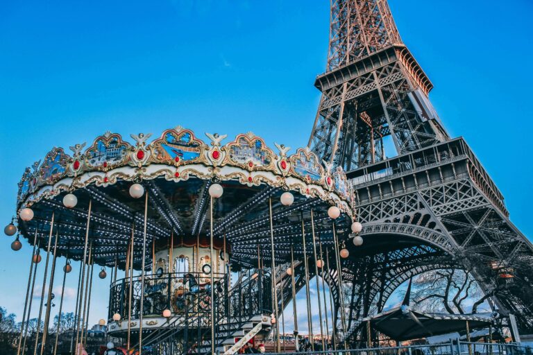 A traditional Parisian carousel in front of the Eiffel Tower. These are perfect for little breaks with toddlers in Paris.