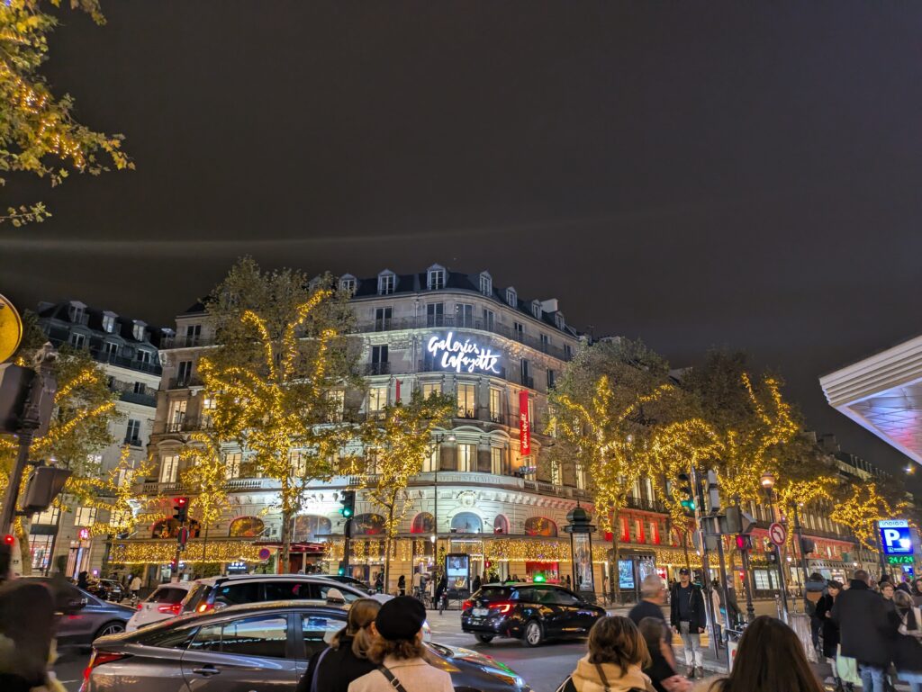 Christmas lights on tree outside of Galeries Lafayette for the holiday season in Paris, France.