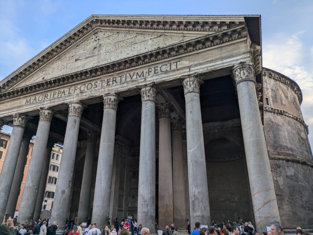 The facade of the Pantheon in Rome, Italy, on a sunny November day. The Pantheon is one of the many iconic landmarks in the heart of the centro storico are in Rome.