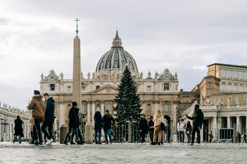 People walkking around the Christmas tree at St Peter's Square, Vatican.