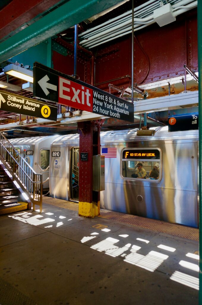 Signs inside a metro station in New York city. The subway is one of the easiest ways to get around New York with kids.