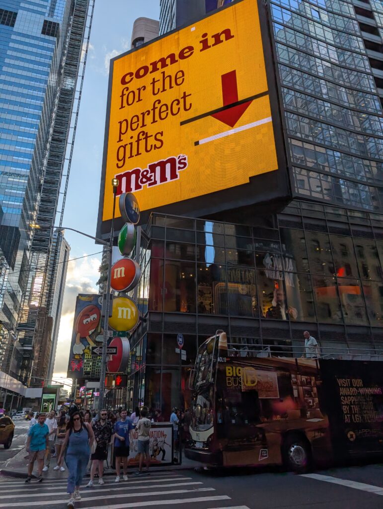 M&Ms store signs in Times Square, NYC. Planning a stop at this store is always a win when visiting New York with kids.