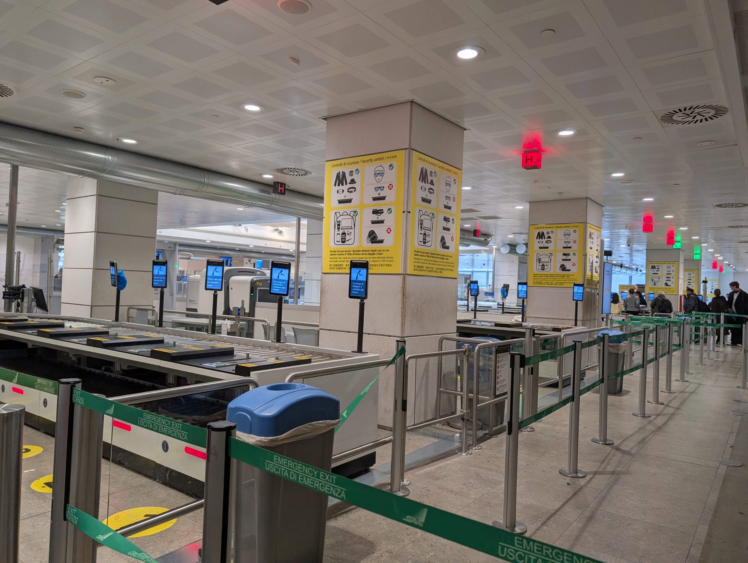 Airport security lines and machines.