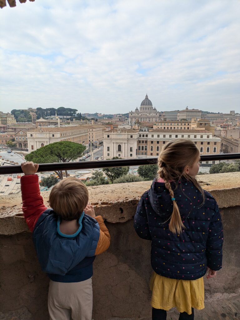 Two kids standing in Castel Sant' Angelo in Rome, Italy.