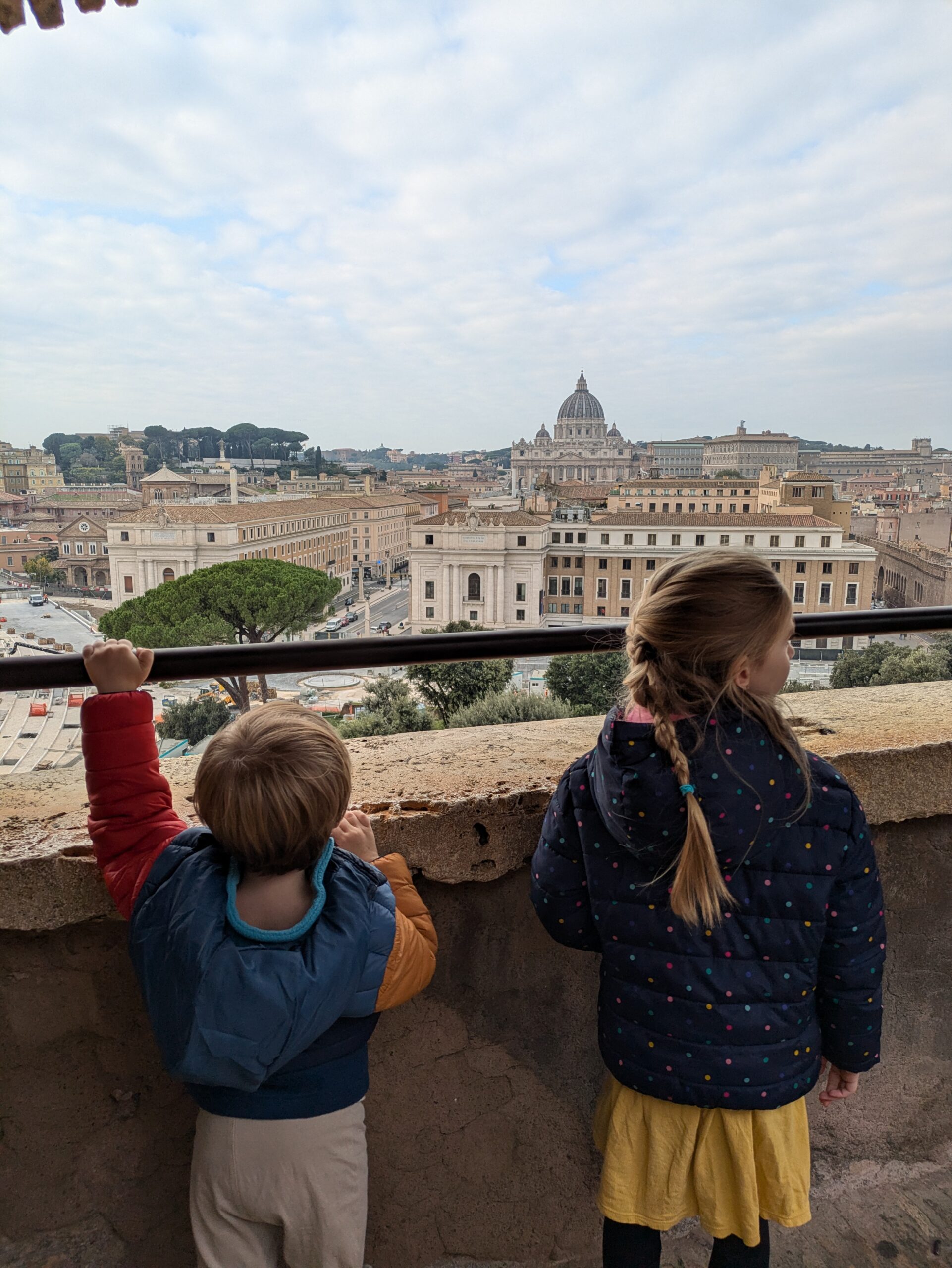 Two kids standing in Castel Sant' Angelo in Rome, Italy.